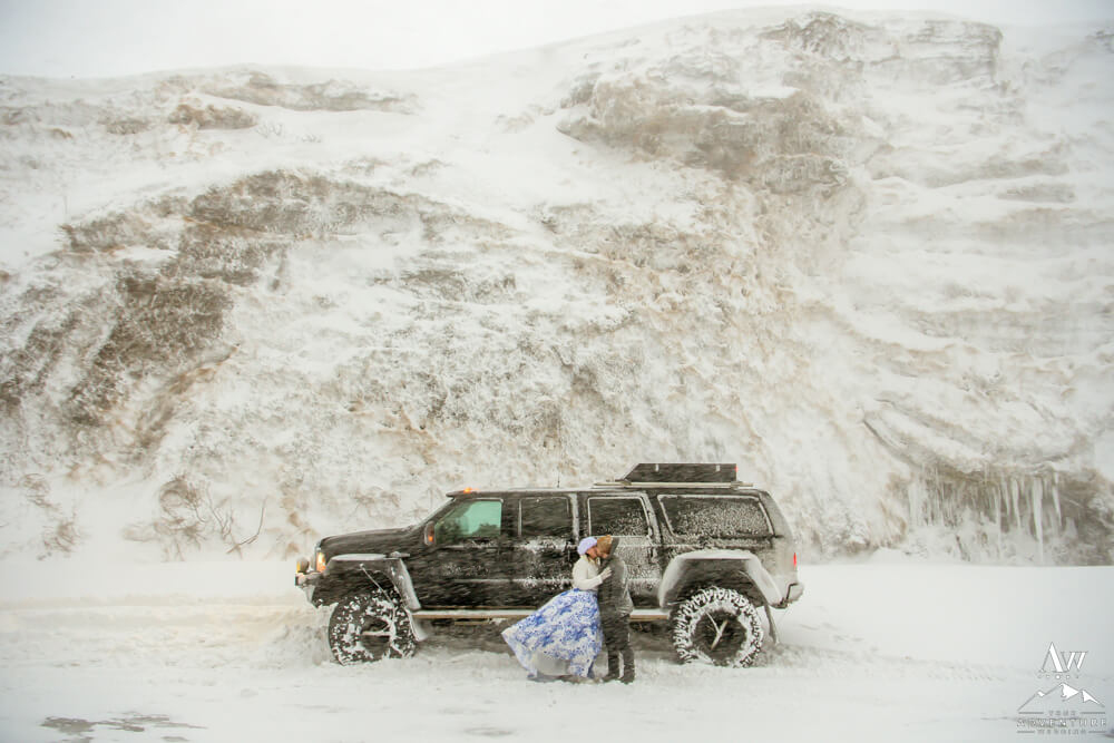 Super Jeep in Blizzard with Iceland wedding couple
