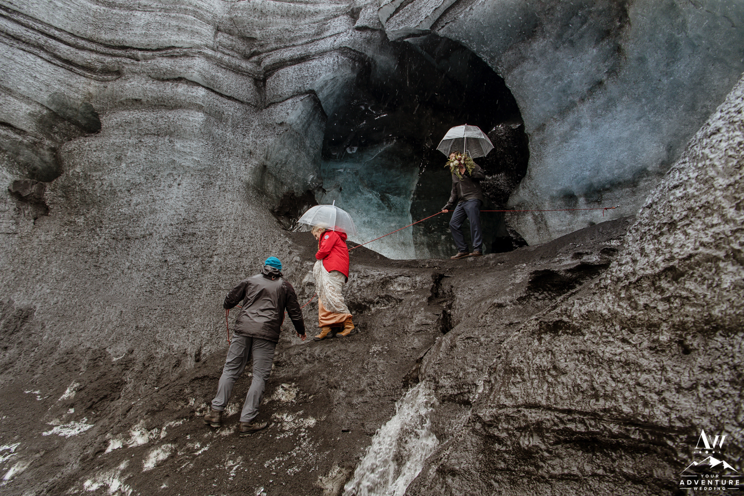 Wedding Couple Climbing down a glacier on elopement day