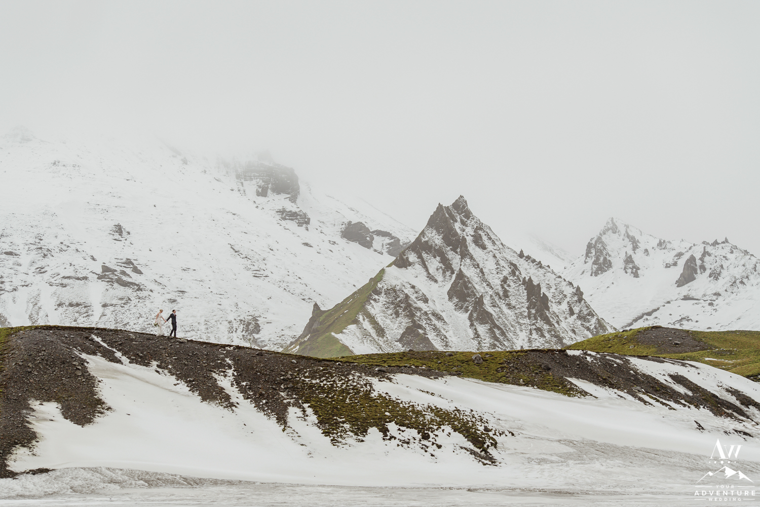 Couple walking on a ridge in Iceland