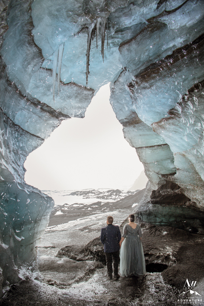Iceland wedding couple exploring an ice cave