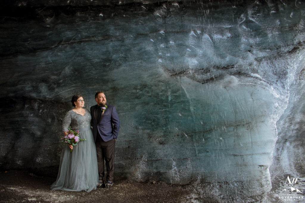 Iceland Elopement couple looking outside of their ice cave