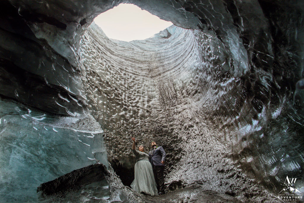 Iceland Elopement Couple Exploring inside of an Ice Cave