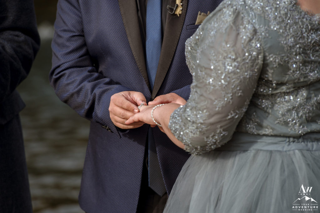 Couple exchanging rings during Iceland Elopement