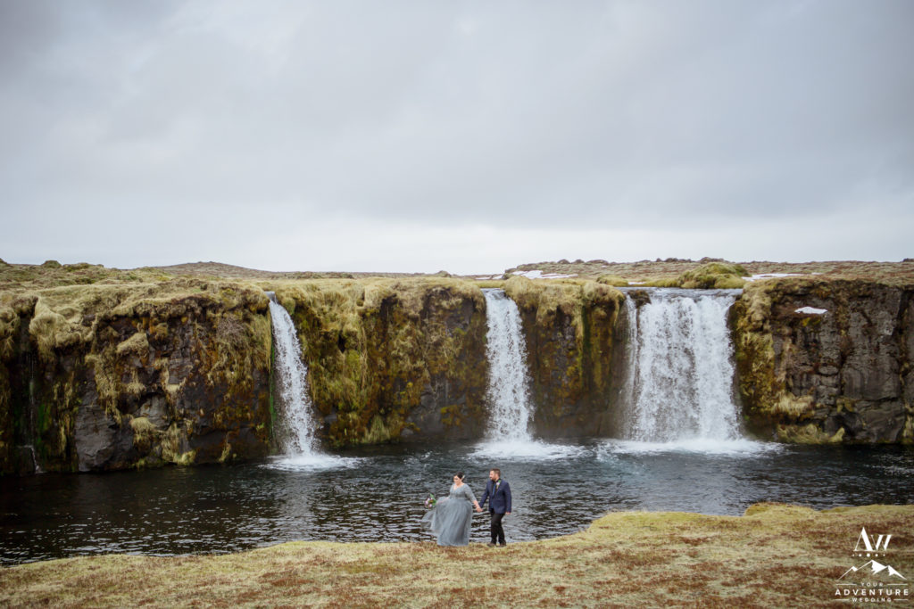 Iceland Wedding Couple exploring a private waterfall