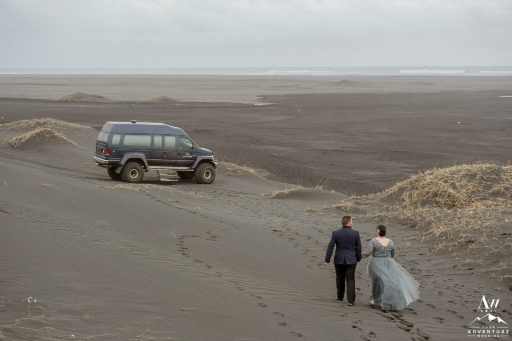 Iceland Wedding Couple walking back to their private super jeep