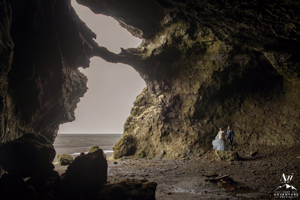 Couple inside of hjorleifshofdi cave during Iceland Elopement