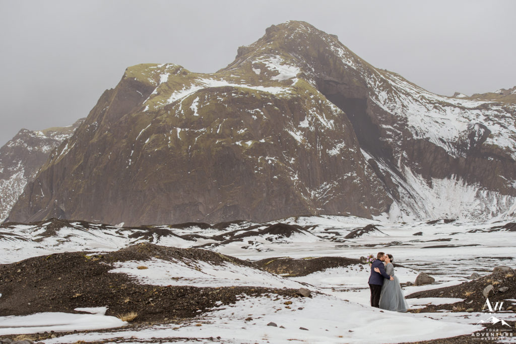 April Iceland Elopement Couple kissing in the snow