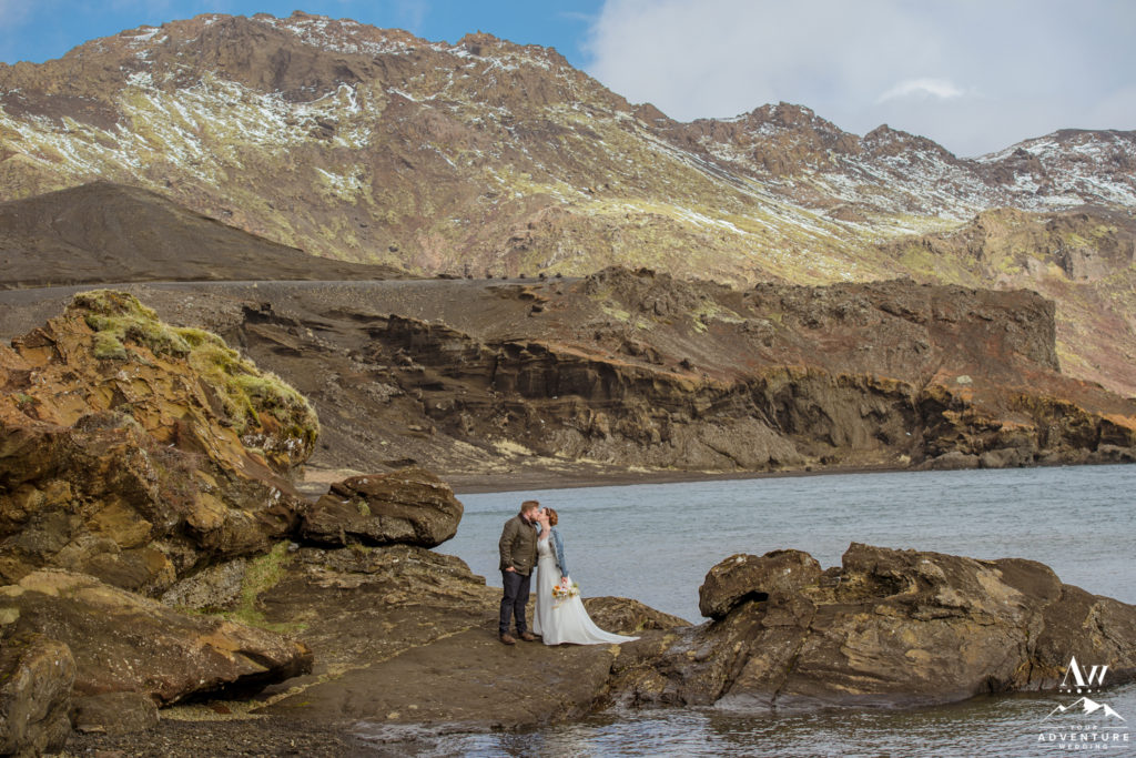Iceland Wedding Couple Kissing beside a lake