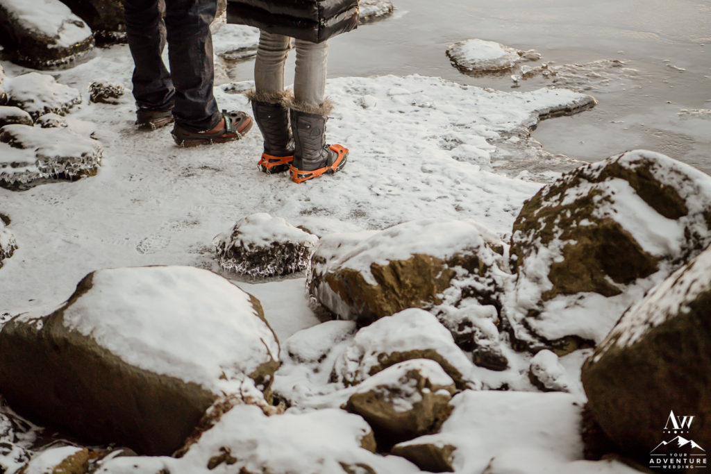 Adventurous couple wearing crampons during Iceland engagement session