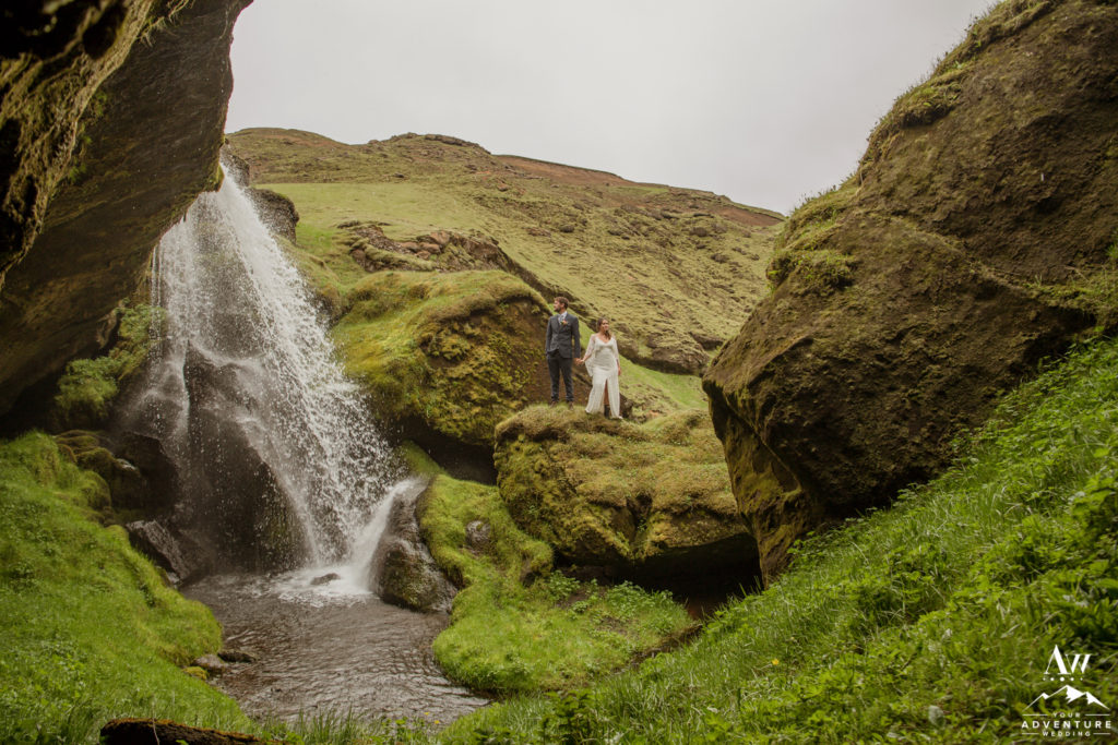 Getting married in Iceland couple at waterfall