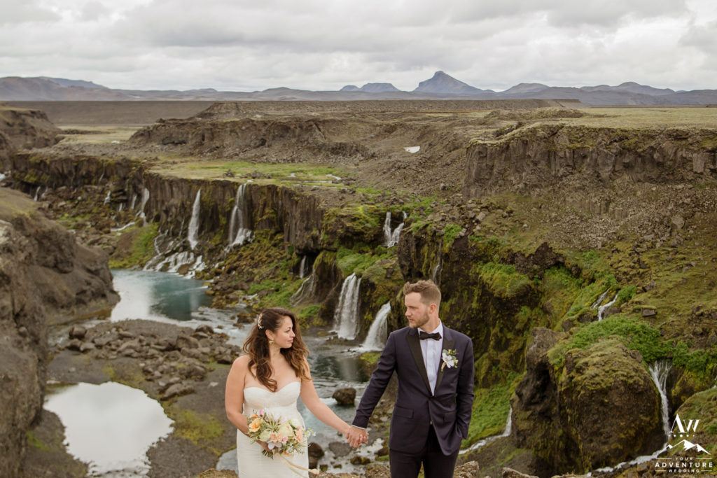 Iceland Wedding Couple looking at each other in front of a canyon