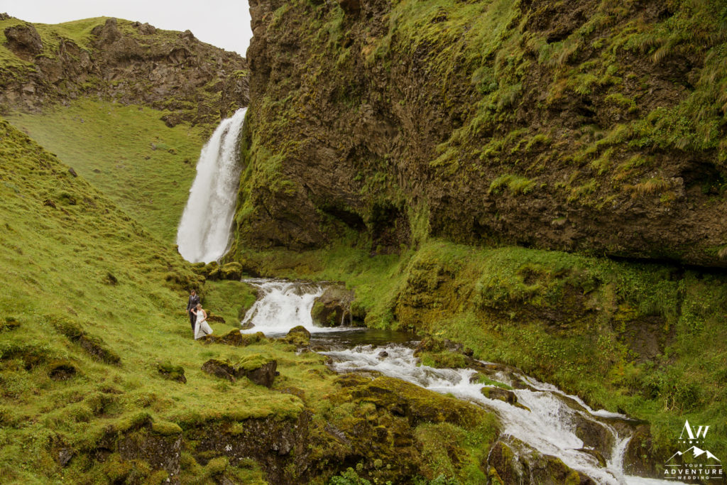 Iceland Wedding Couple exploring a private waterfall