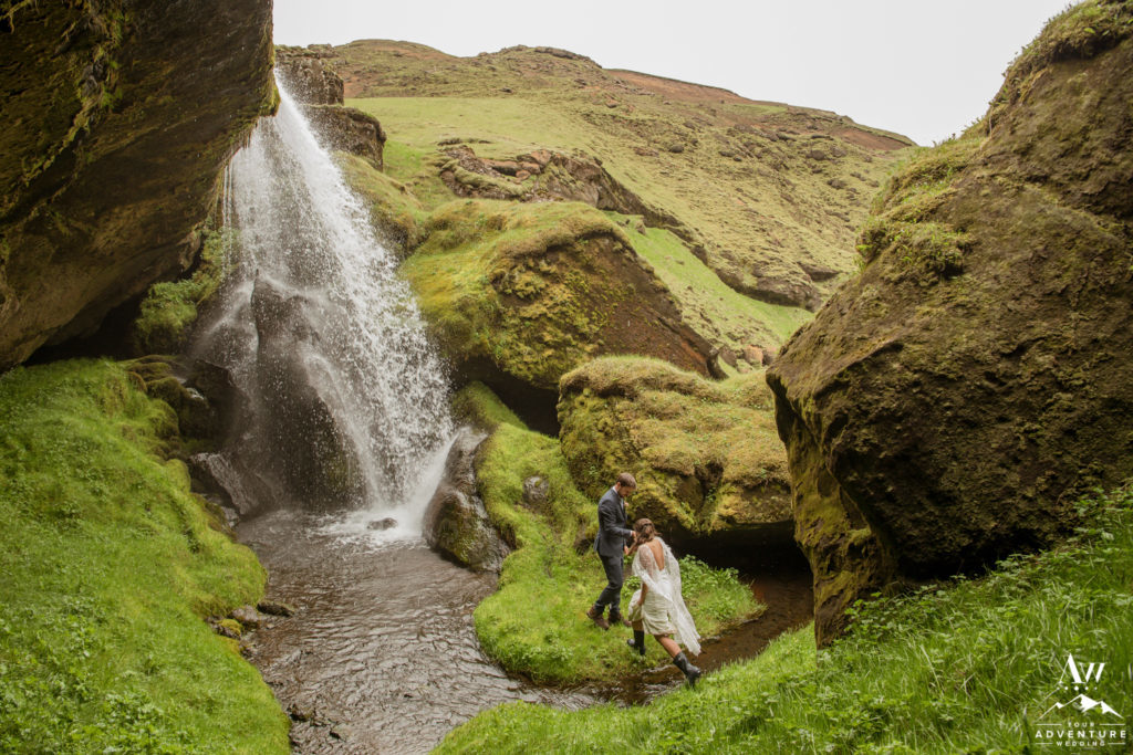 Iceland-Elopement-Photographer-Couple crossing a river together