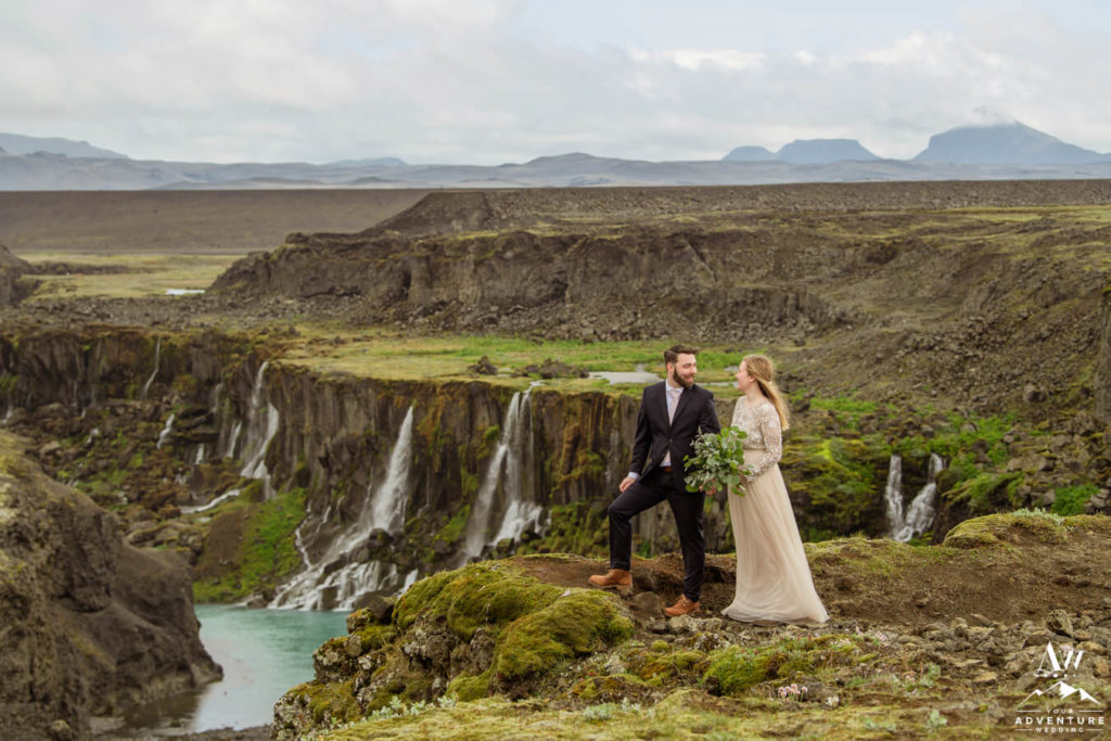 Ethereal Iceland Elopement Couple Standing on a cliff