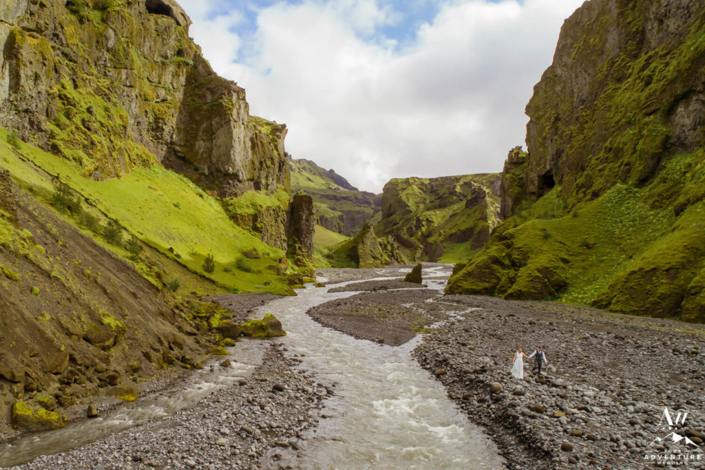 Iceland Elopement Couple walking in a canyon