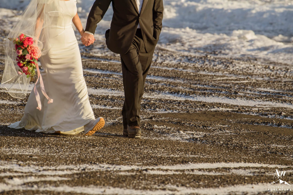 Iceland elopement couple walking on black beach