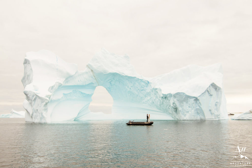 Antarctica Wedding Couple standing in front of iceberg