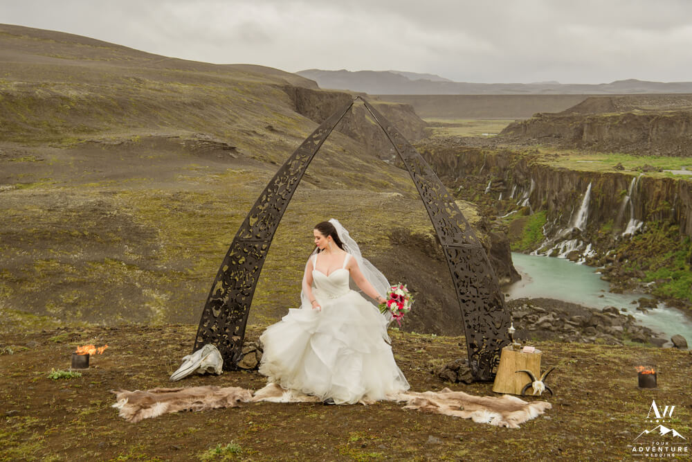 Iceland Elopement Bride under black arch
