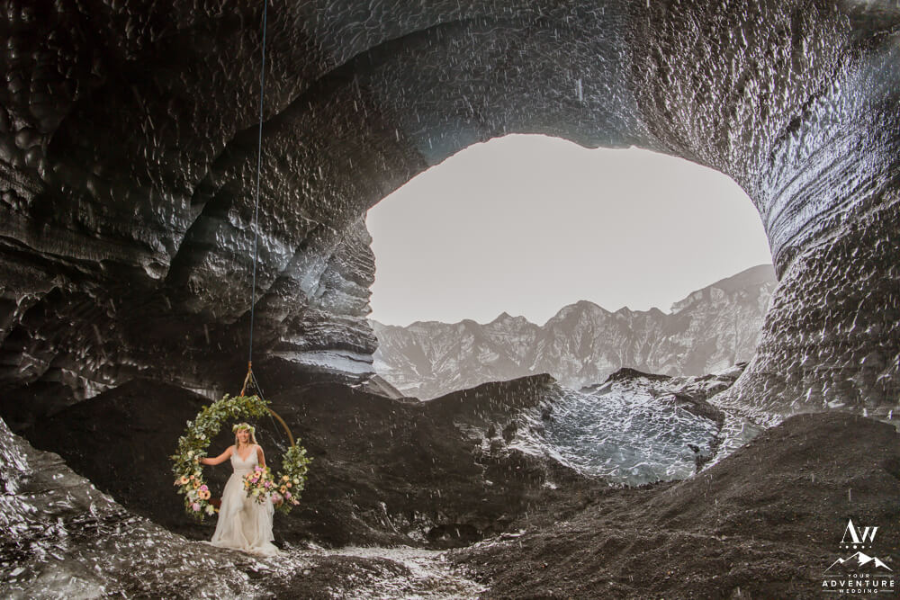 Iceland Elopement Bride sitting in Floral Swing