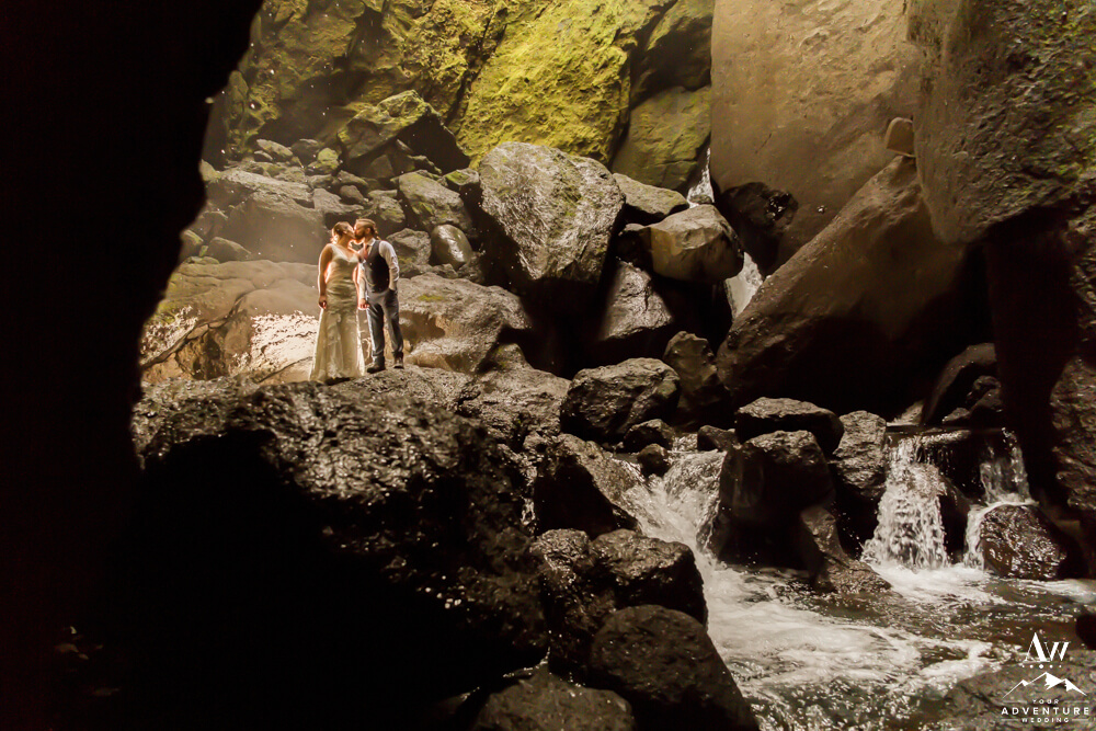 Iceland Wedding Couple kissing in Stakkholtsgjá Waterfall