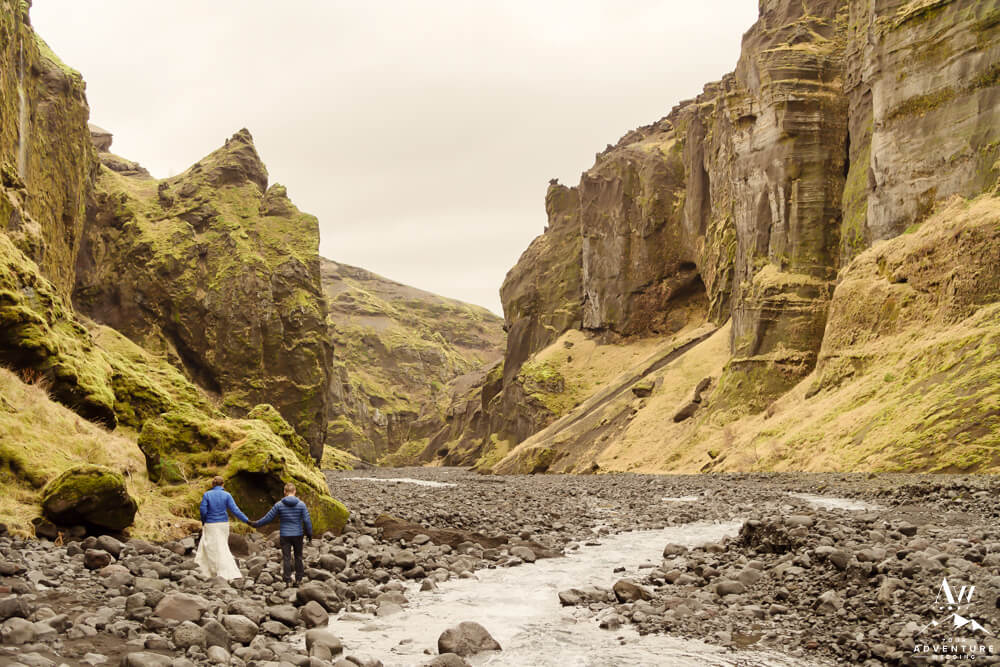 Iceland Wedding Couple hiking out of Stakkholtsgjá