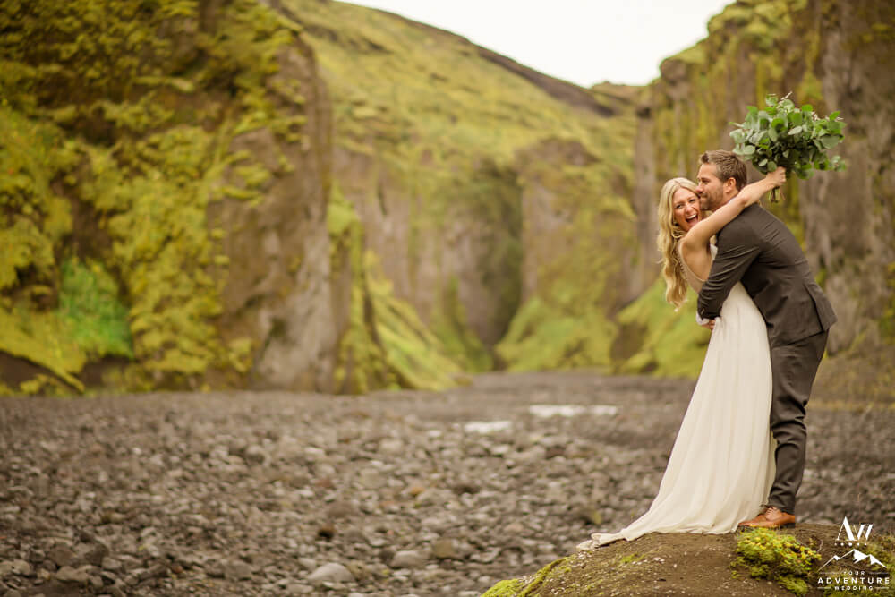 Couple eloping in Iceland laughing