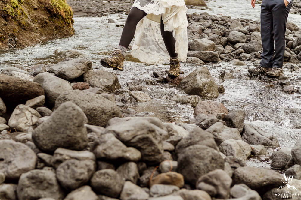Iceland Elopement Bride hiking through a river