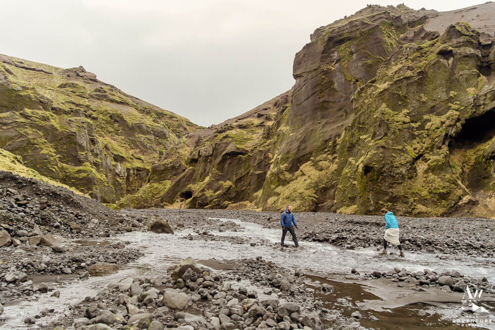 Iceland Elopement Couple hiking through river