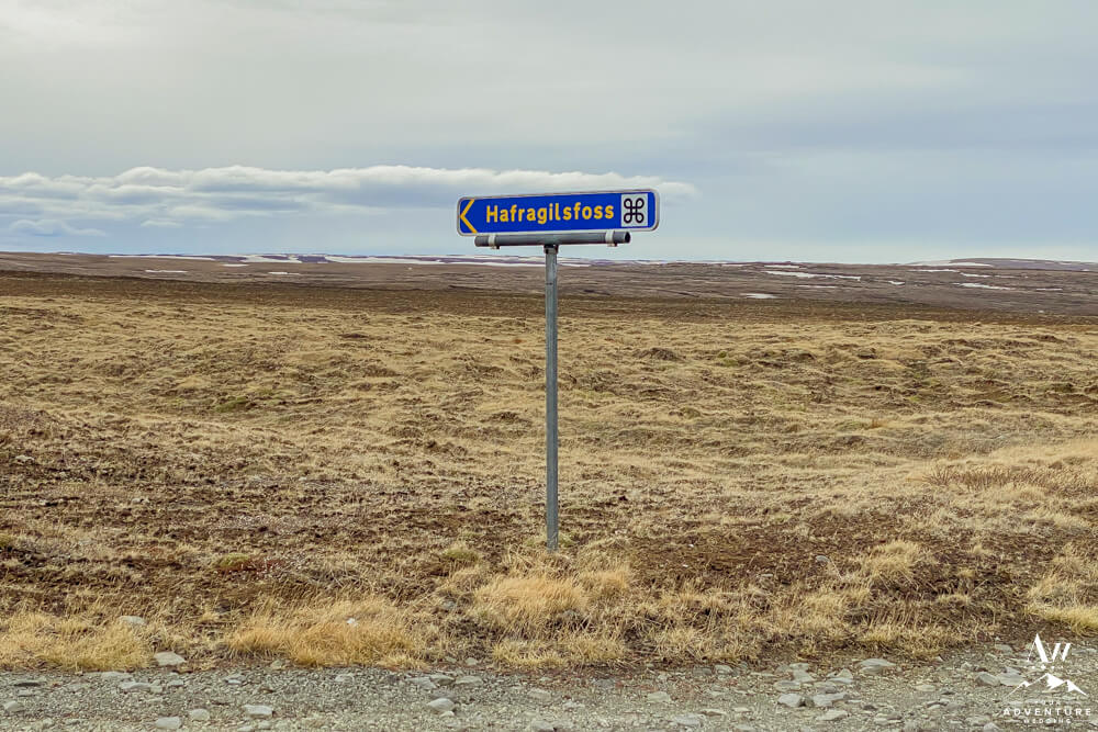 Woman at east side of Hafragilsfoss Waterfall