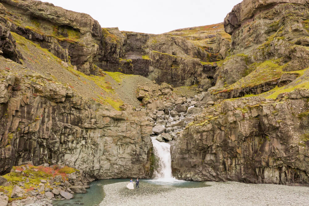 Playful Elopement Couple at Iceland Waterfall