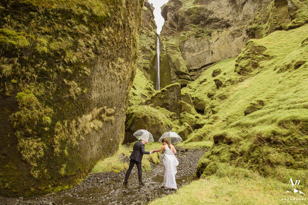 Rainy Nuptials Iceland Couple Hiking in Canyon
