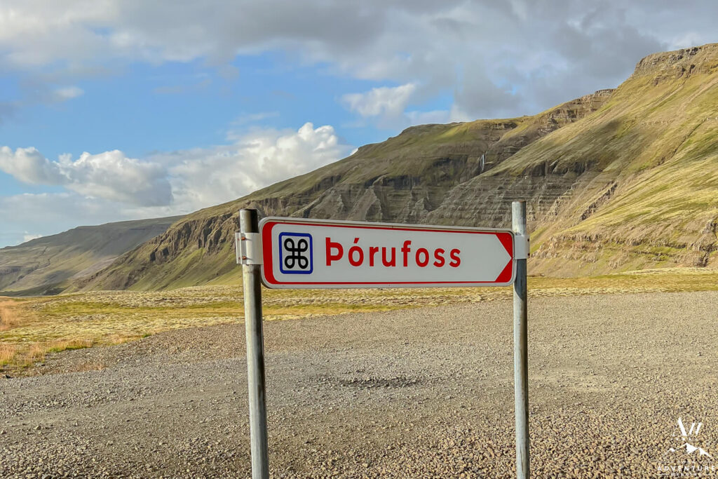 Þórufoss waterfall sign and parking lot