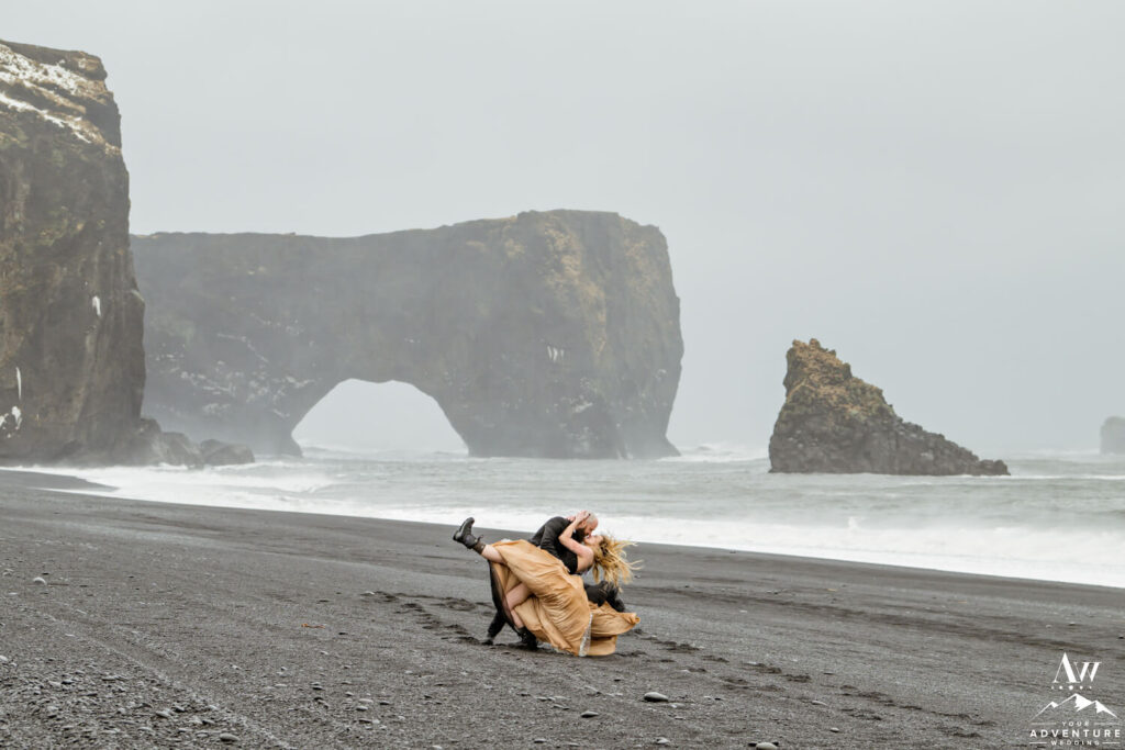 Windswept Iceland wedding couple on Dyrholaey Beach