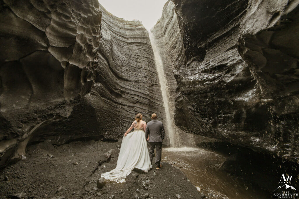 Glacier Waterfall Elopement Couple Inside Canyon