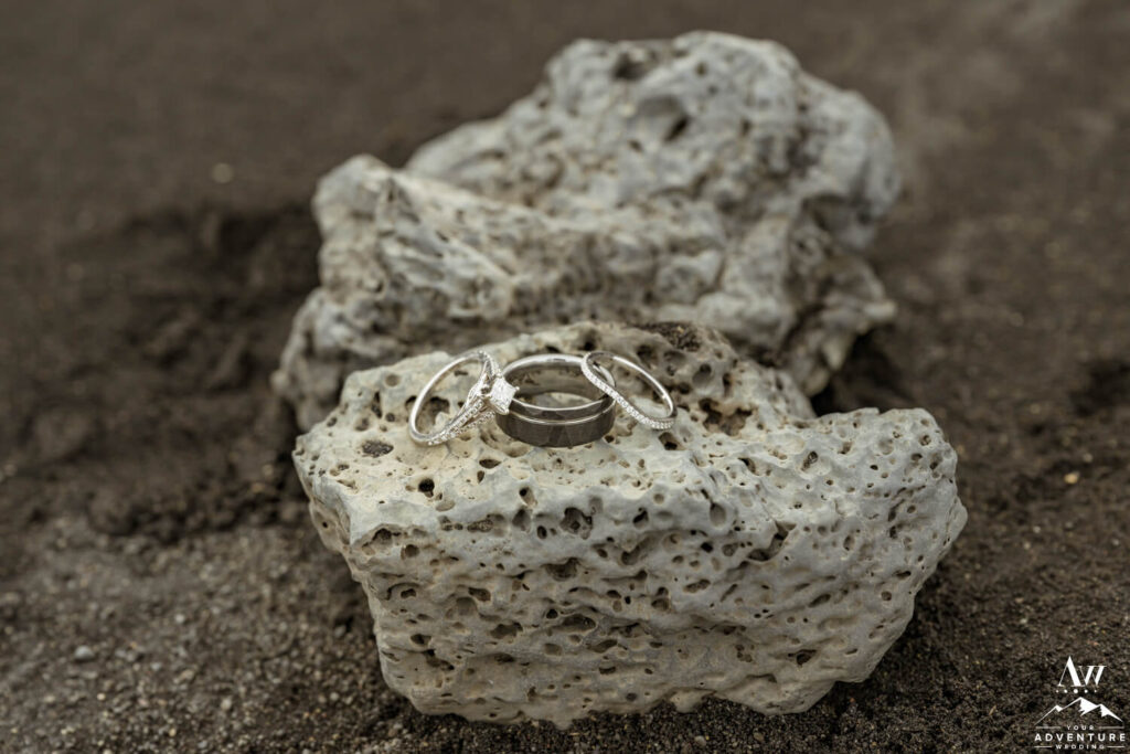 Iceland Wedding Rings on Rock and Black Sand